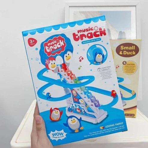 Automatic penguin climbing stairs and slide track toy with music and lights