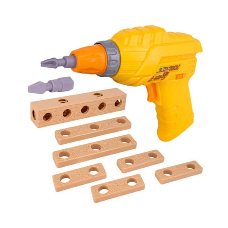 Overhead view of a disassembled kids' toy construction set showing an orange electric toy drill, a yellow screwdriver, a blue socket wrench, plastic screws, nuts, and faux-wood building blocks spread across a yellow tray.