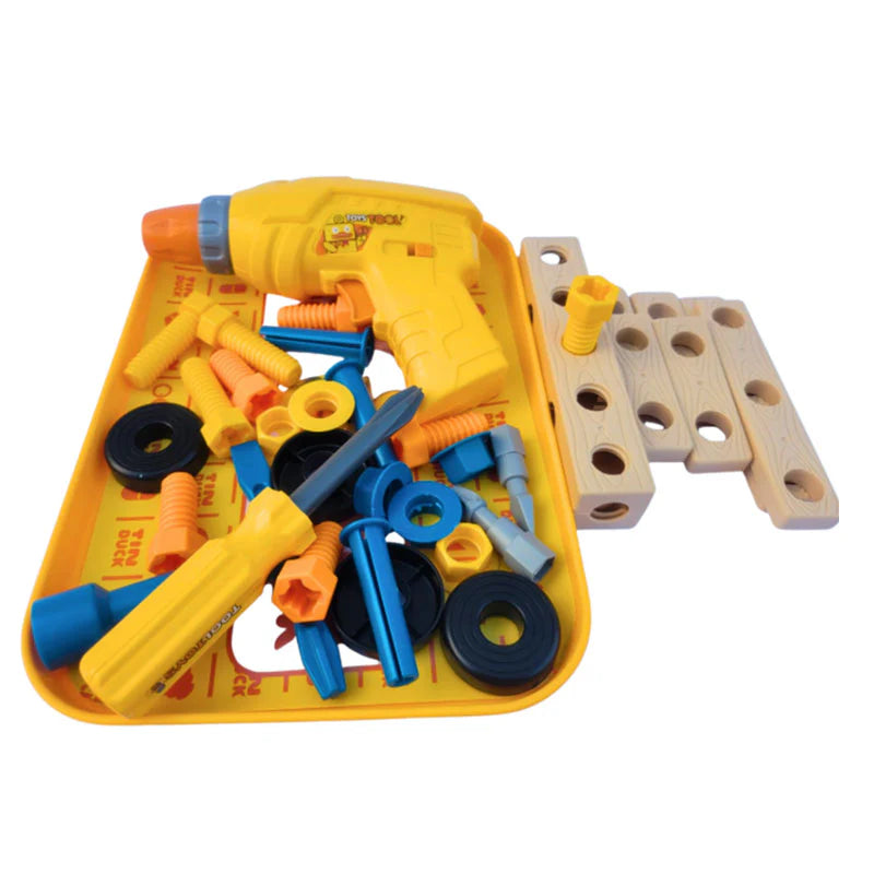 Kids toy tool set including an interactive toy electric drill, manual screwdriver, and colorful plastic building pieces packaged inside a yellow organization tray.