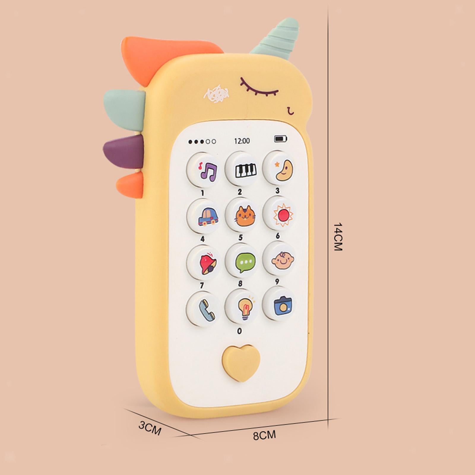 Toddler holding a yellow dinosaur unicorn cell phone toy while practicing pretend play conversations.