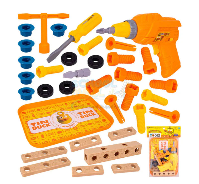 Loose pieces of a toddler STEM building kit showcasing an orange electric toy drill, interchangeable drill bits, a yellow manual screwdriver, blue socket wrench, and faux-wood blocks on a yellow tray.