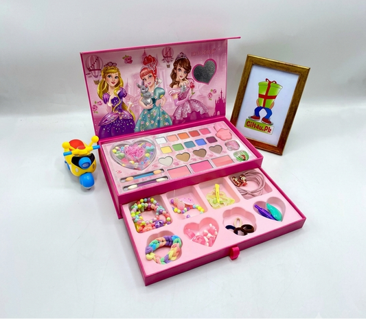 Open 2-layer pink princess makeup box showing colorful eyeshadows, blushes, and lower jewelry drawer with bracelets and hair accessories.