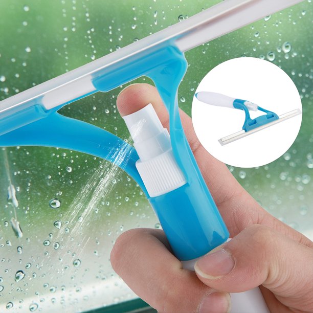 Handheld spray window cleaner tool with a pink handle, rubber squeegee blade, and built-in water spray nozzle cleaning glass.