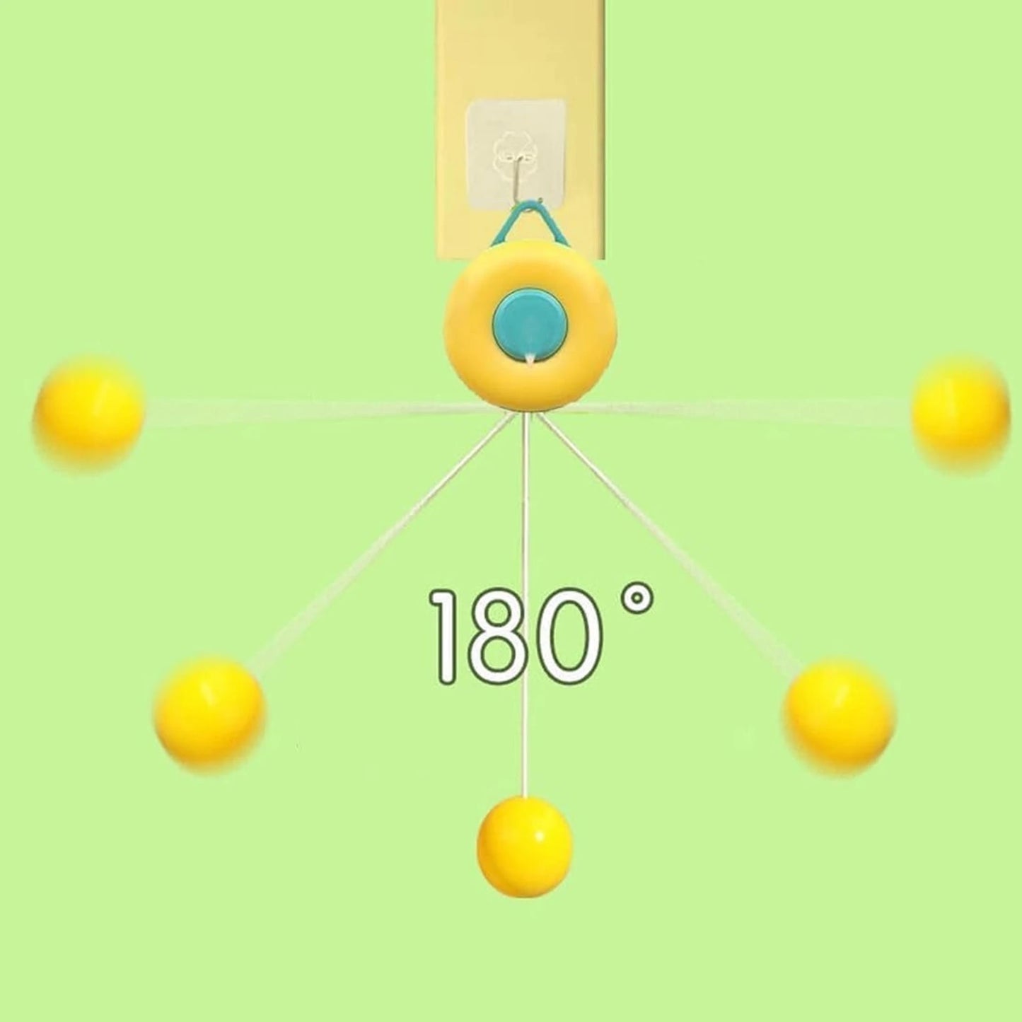 Close-up view of a yellow donut-shaped indoor ping pong trainer mechanism hanging from a doorway showing 180-degree ball bounce physics.