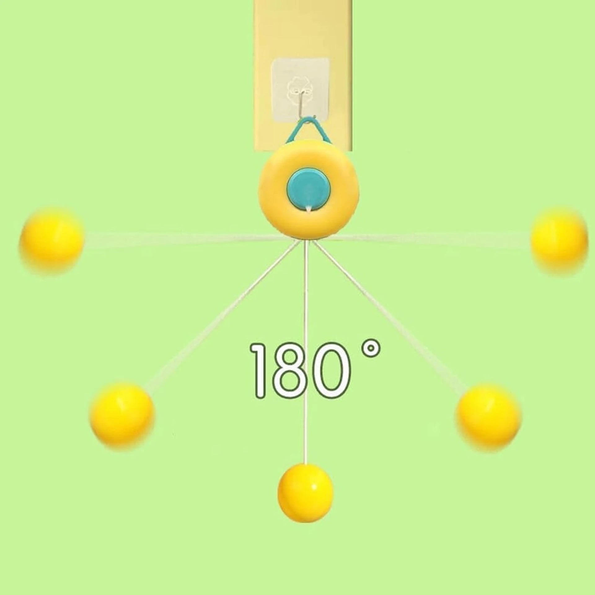 Close-up view of a yellow donut-shaped indoor ping pong trainer mechanism hanging from a doorway showing 180-degree ball bounce physics.